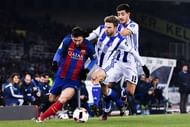 SAN SEBASTIAN, SPAIN - JANUARY 19:  Lionel Messi of FC Barcelona competes for the ball with Asier Illarramendi (C) and Yuri Berchiche of Real Sociedad de Futbol during the Copa del Rey quarter-final first leg match between Real Sociedad and FC Barcelona at Anoeta stadium on January 19, 2017 in San Sebastian, Spain.  (Photo by David Ramos/Getty Images)